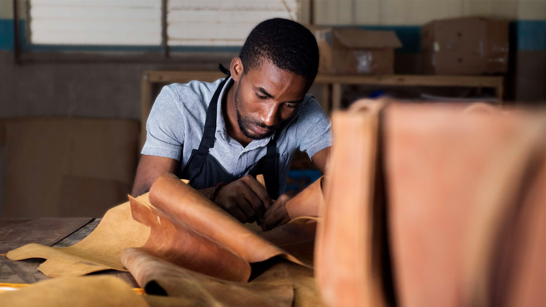 skilled artisan working with leather.