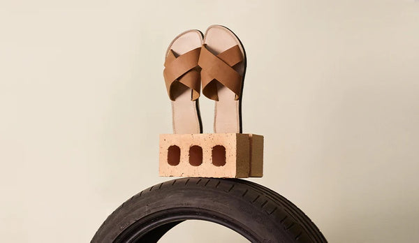 a pair of sandals made out of recycled tyres.