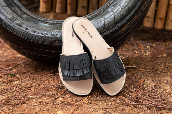 black sandals made out of recycled materials.