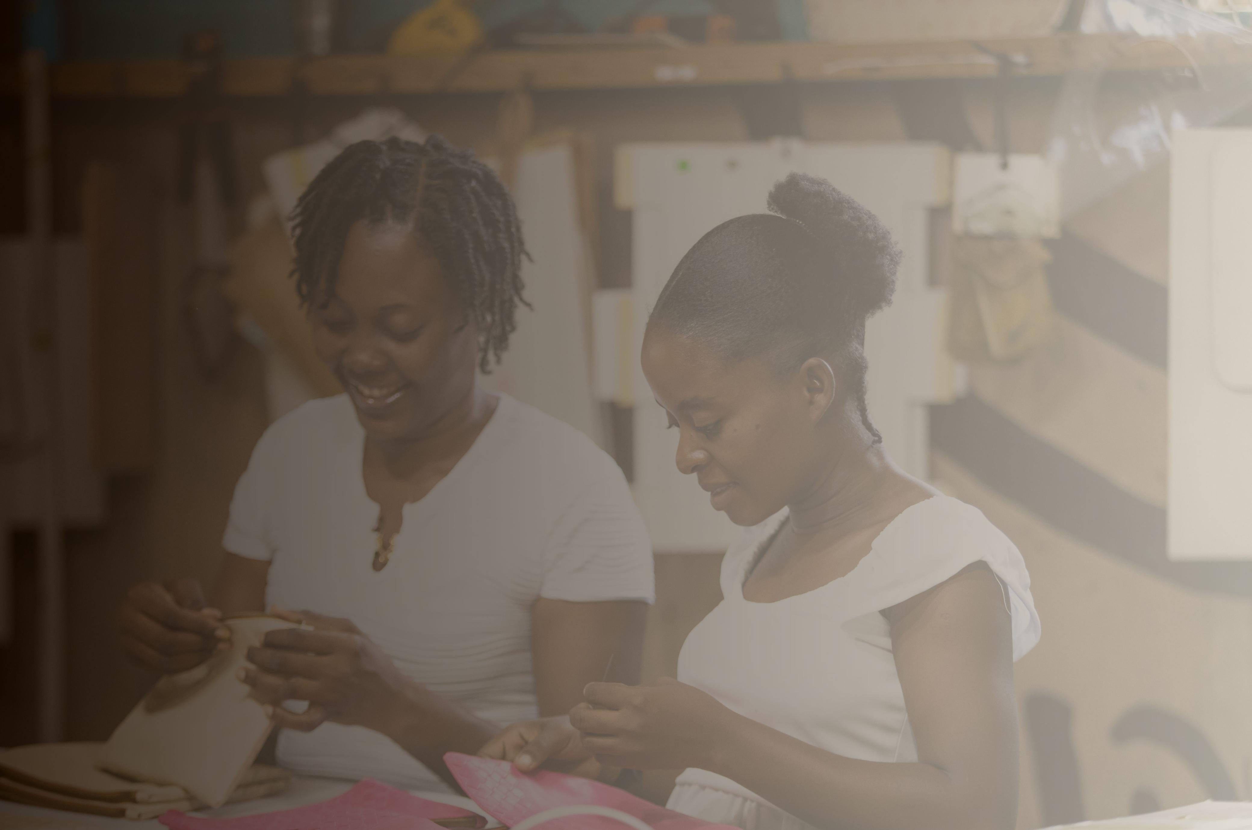 Two women sewing, image from WhatsApp, June 18, 2025.