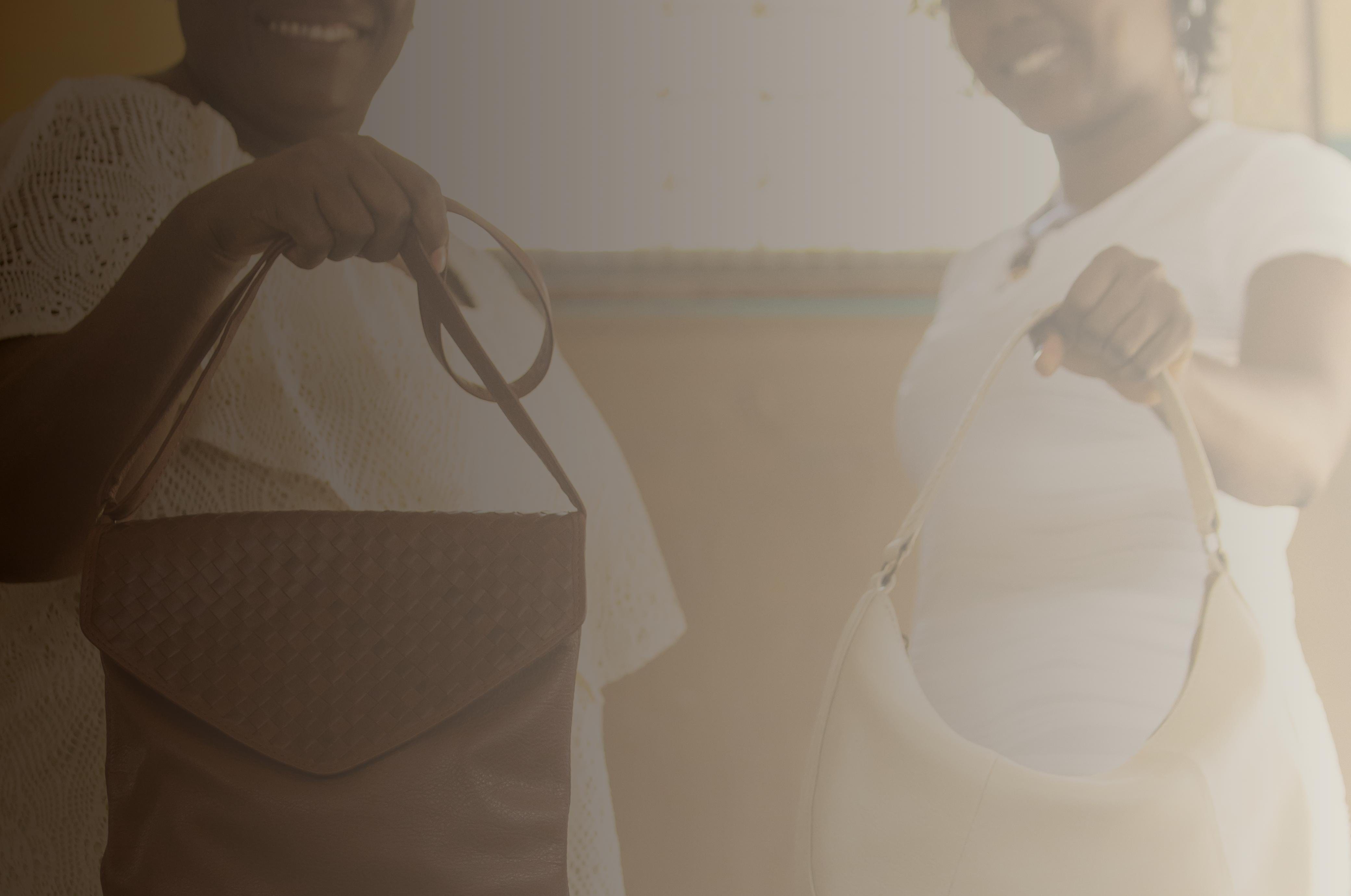 Two women holding handbags, June 19, 2025
