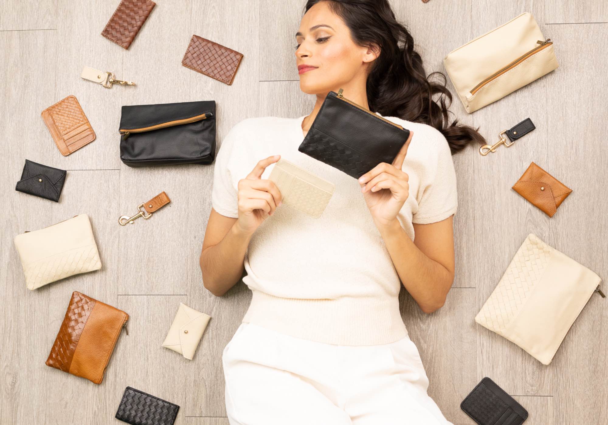 Woman surrounded by affordable leather accessories