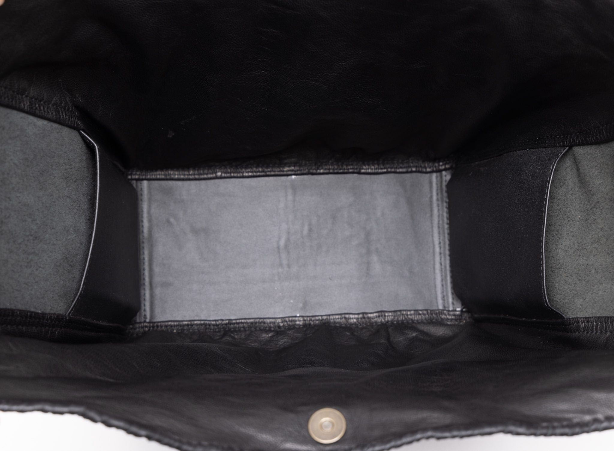 Close-up of a black leather bag on a white background