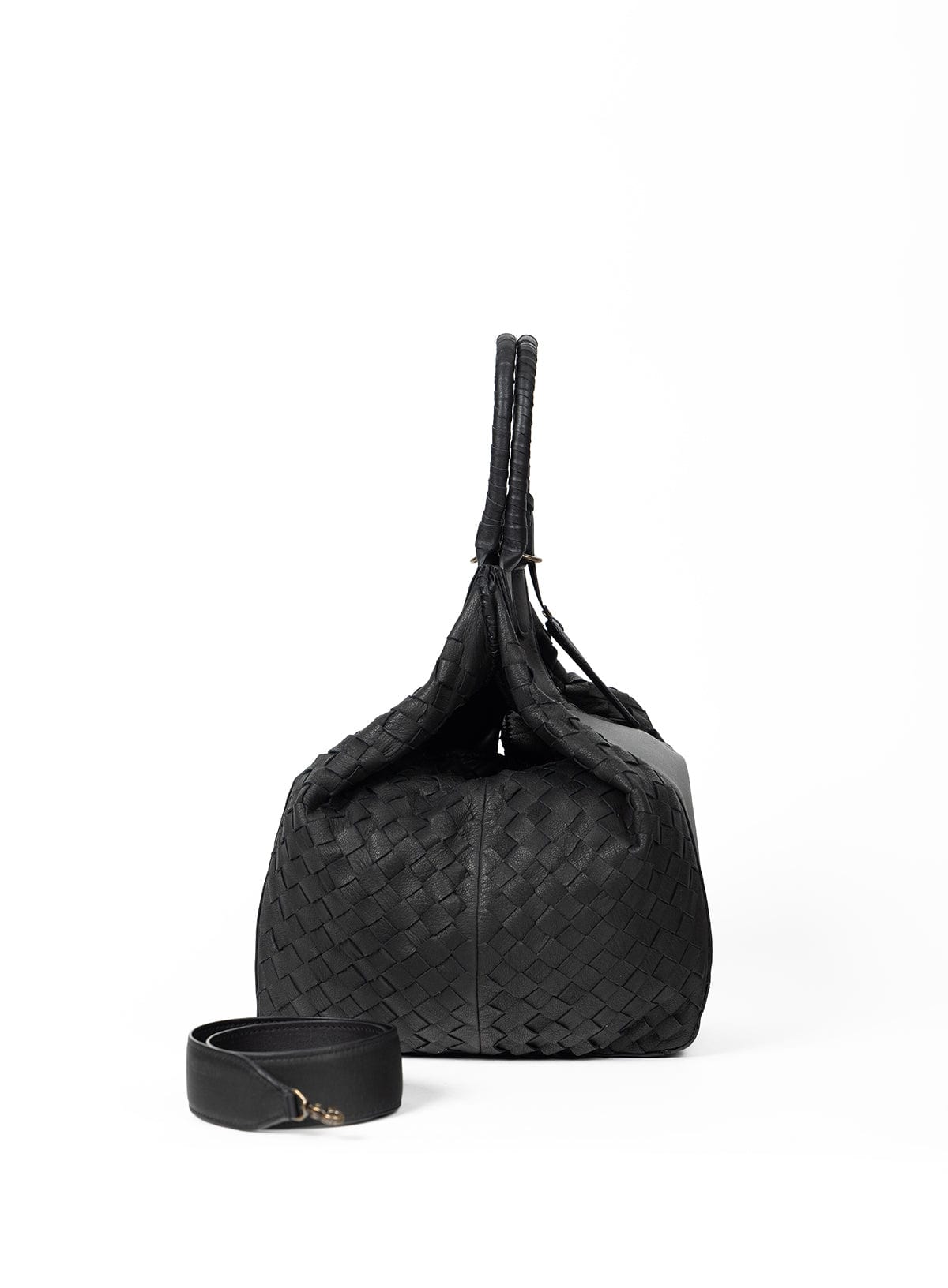 Black woven handbag with matching strap on a white background