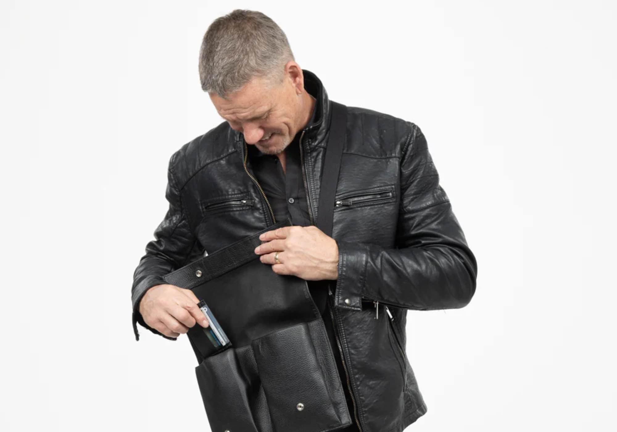 Man in leather jacket with Billy Collection Claymore bag interior