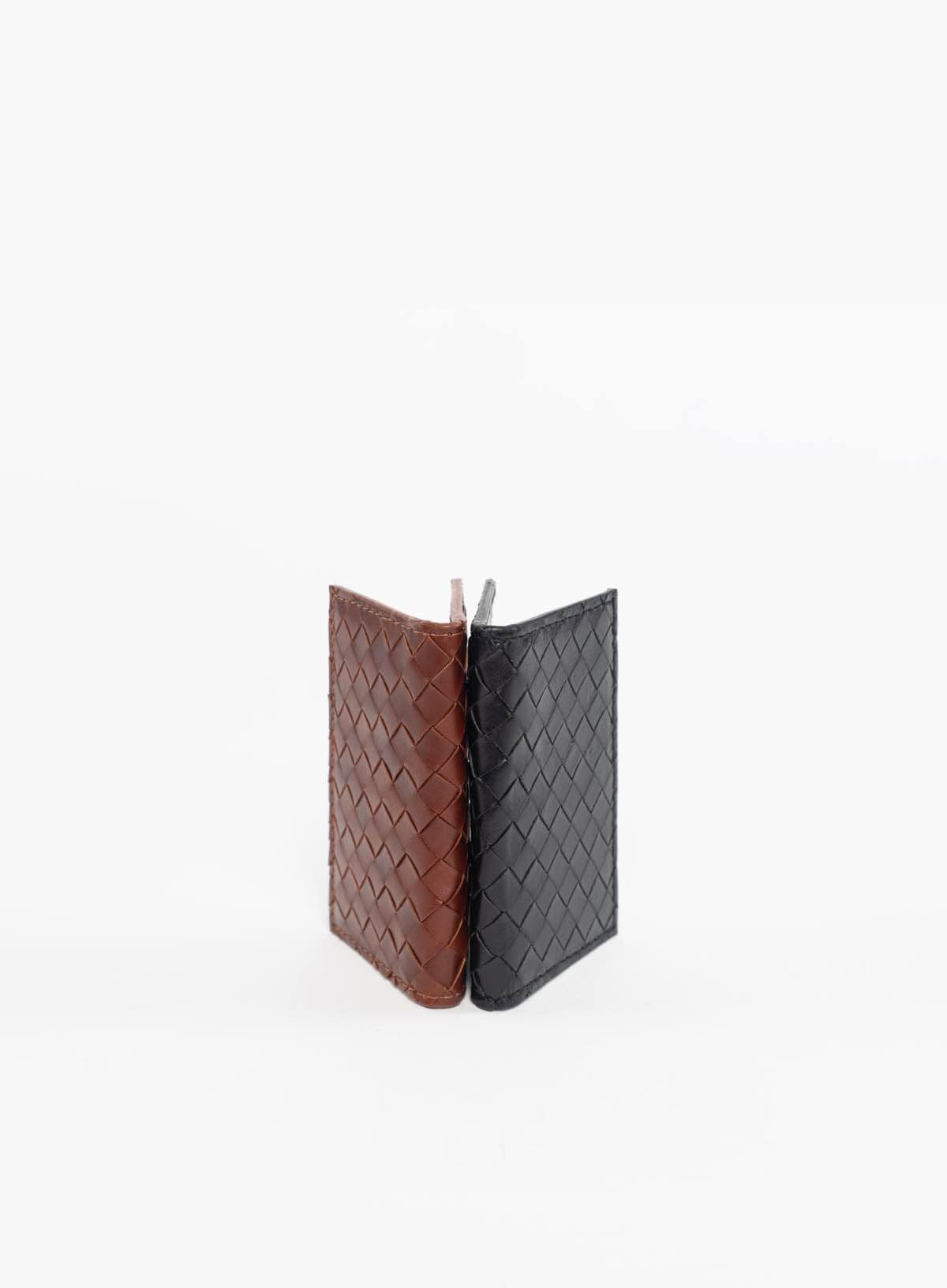 classic woven wallets in brown and black in white background
