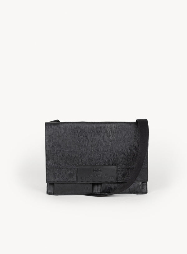 immediate action claymore bag in black showcasing the front-view and closure.