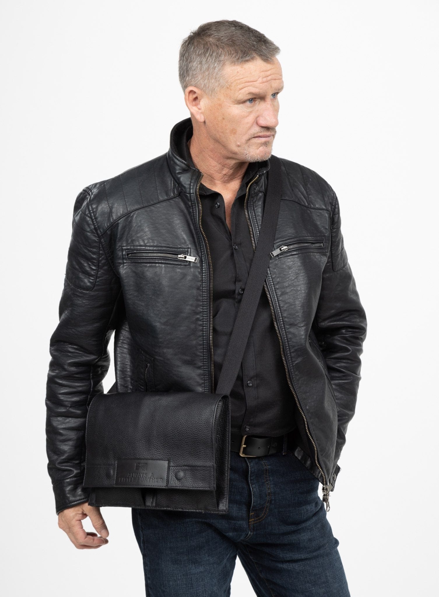 Man wearing a black leather bag on a white background