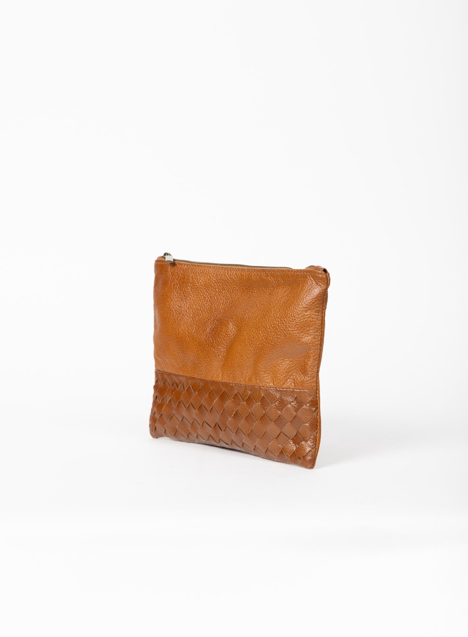 Cognac leather pouch on a white background