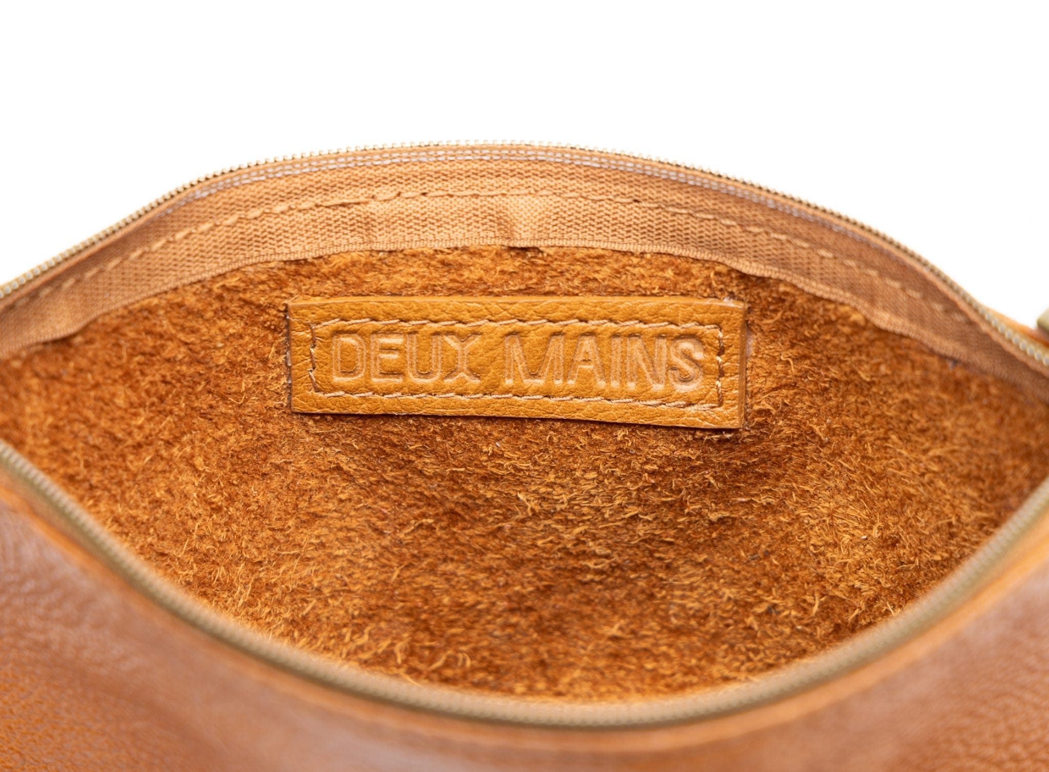 Deux Mains cognac leather pouch interior