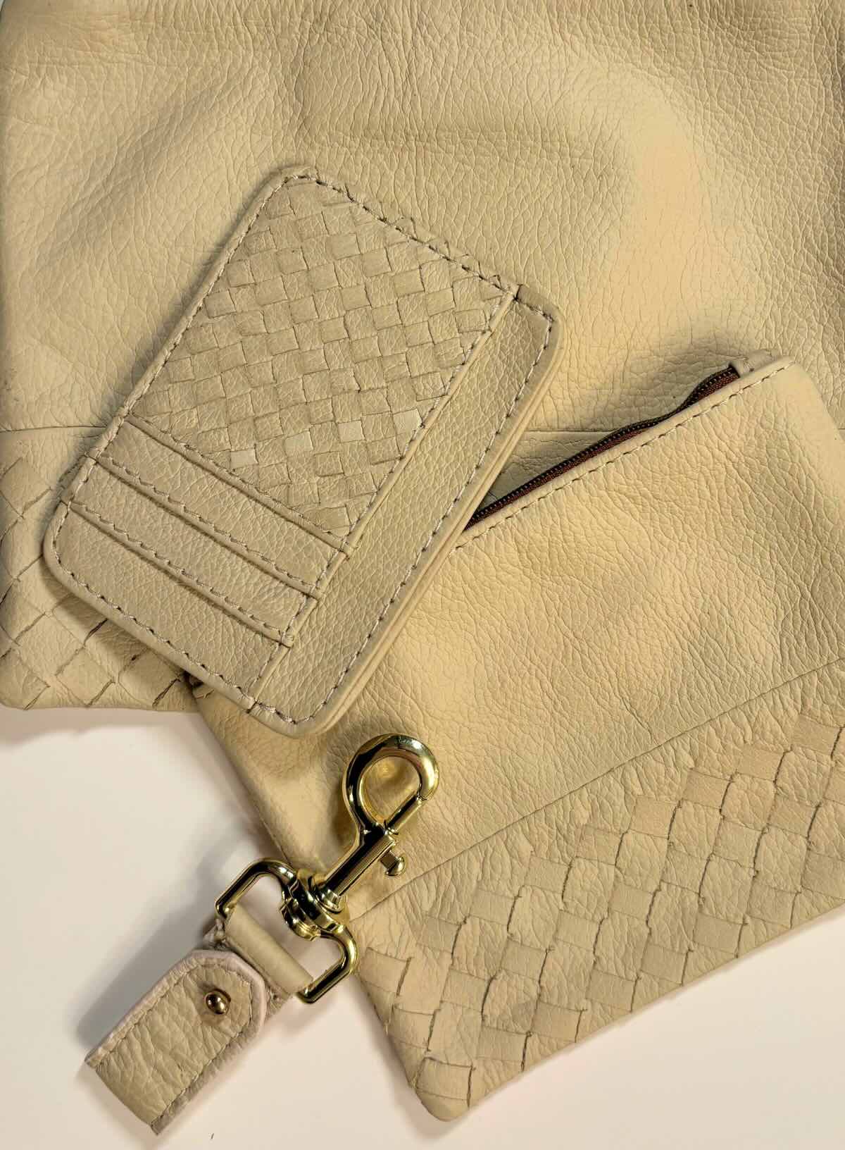 Beige leather accessories on a white background