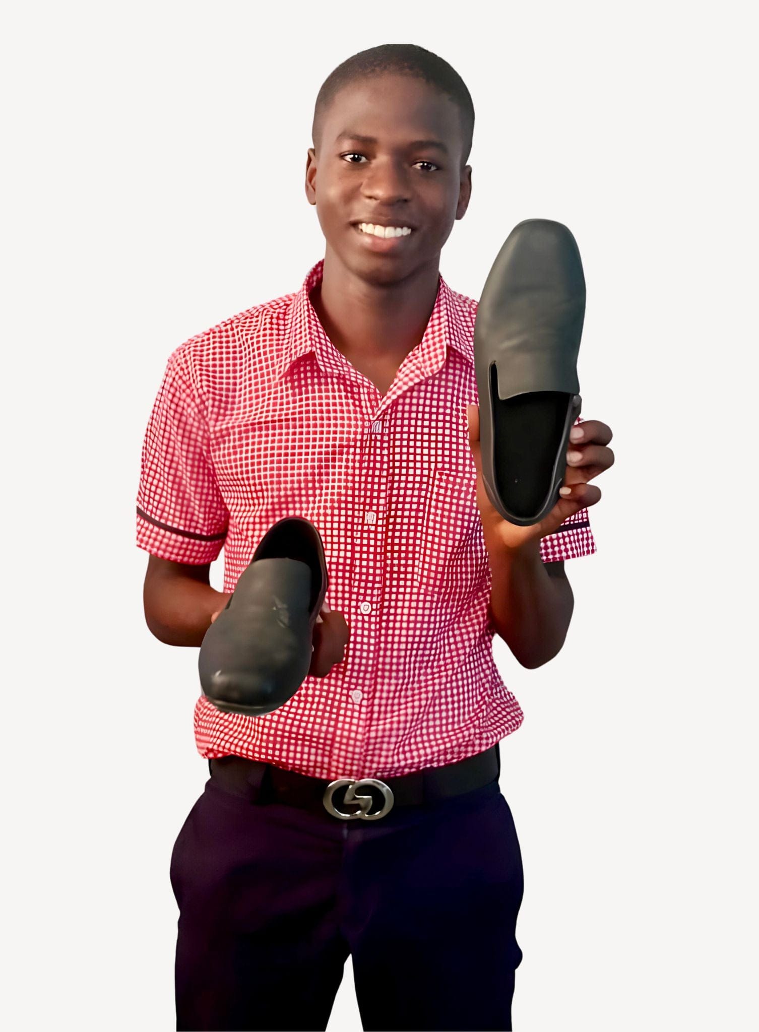 Man holding black leather shoes for new website