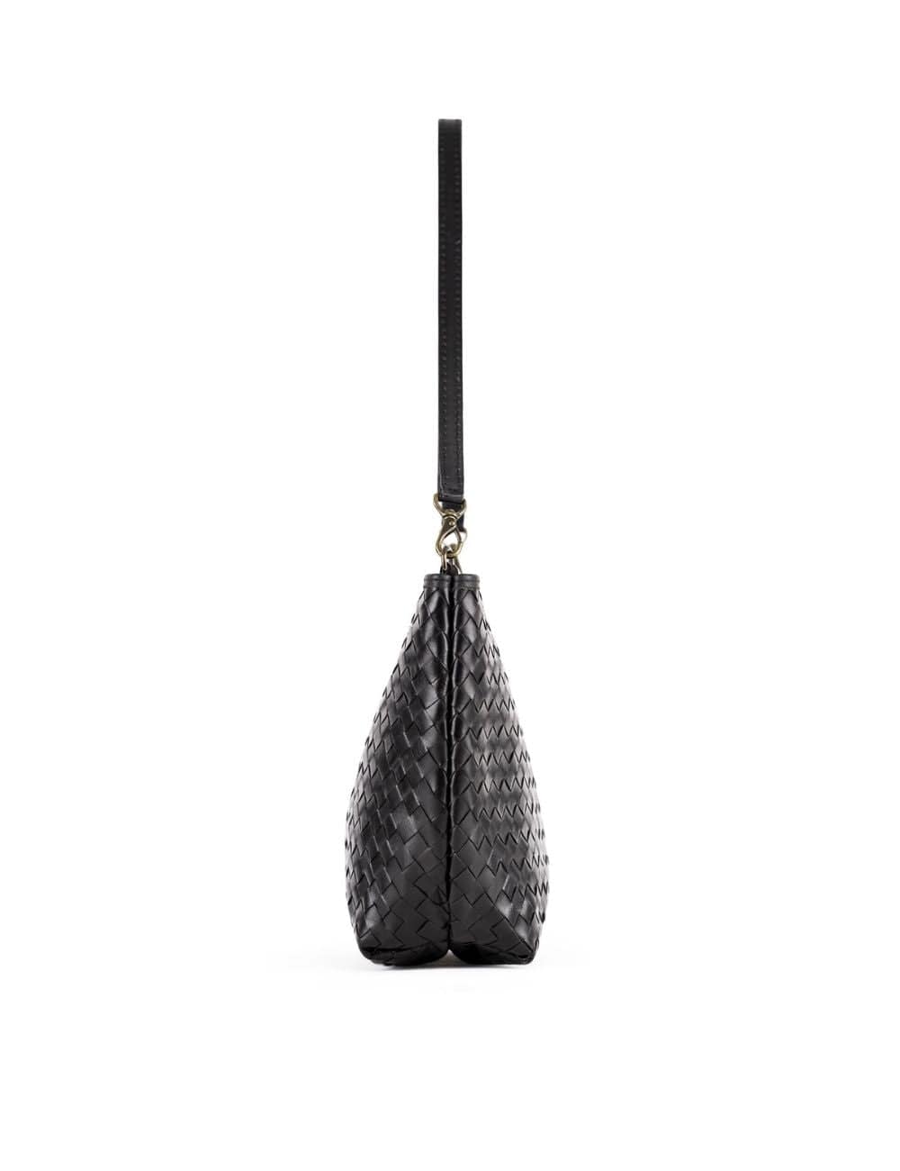 Black quilted handbag with a strap on a white background