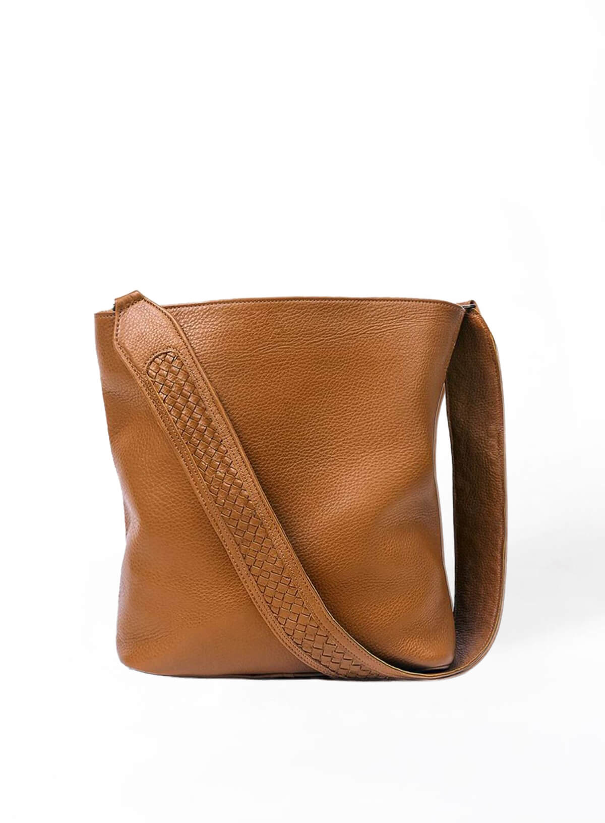 Cognac leather handbag with a strap on a white background