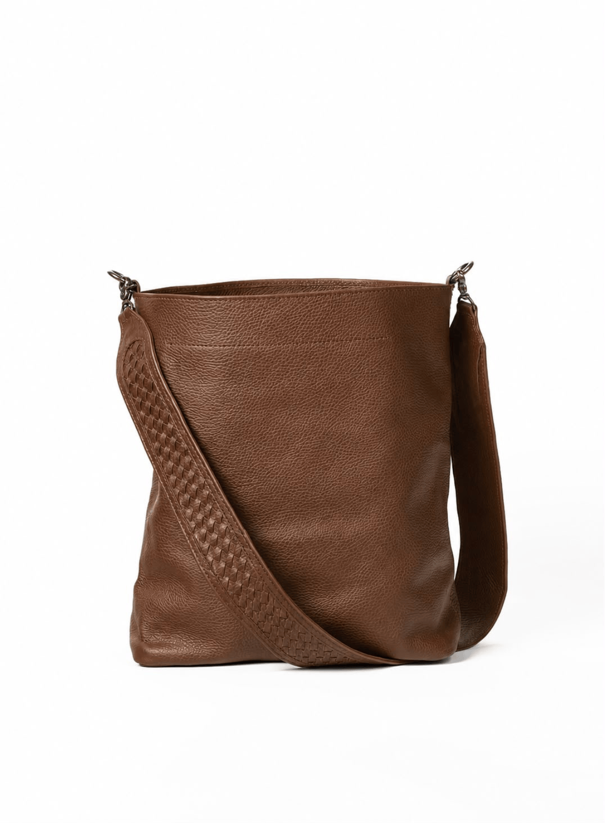 A brown leather bucket bag with a textured woven pattern on the strap and silver-tone metal hardware, shown on a plain white background.