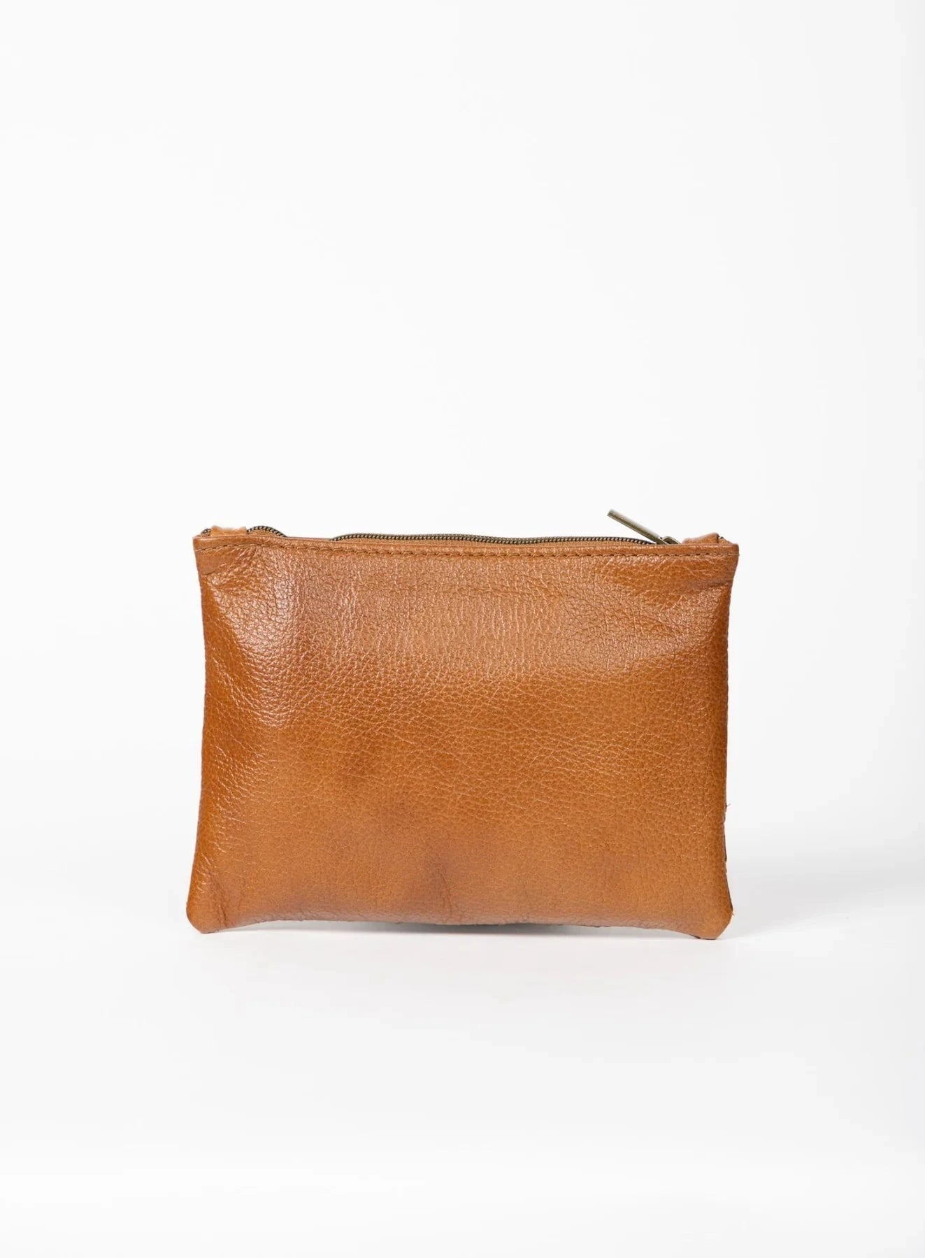 Cognac leather pouch on a white background