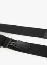 the colonel crossbody in black showcasing strap and tag attached.