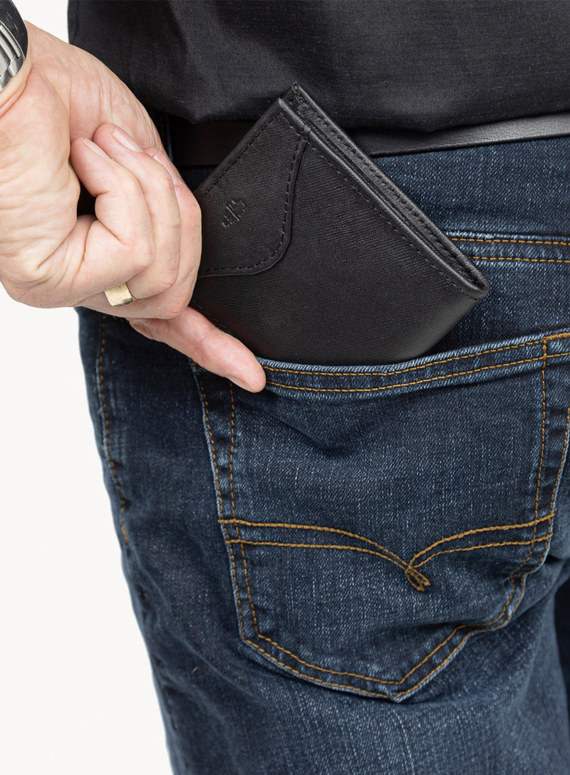 the hotgun wallet accessory for him in black detailed exterior model placing in pocket.