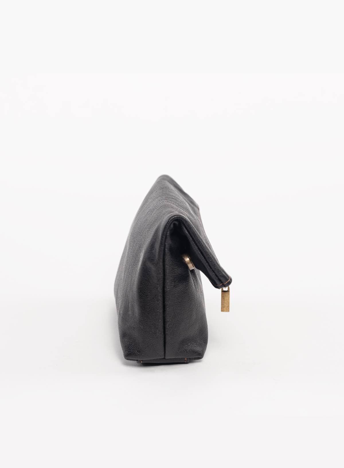 Black leather makeup bag on a white background