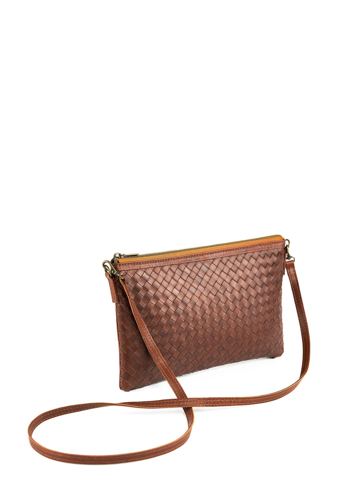 Brown woven leather crossbody and clutch bag on a white background