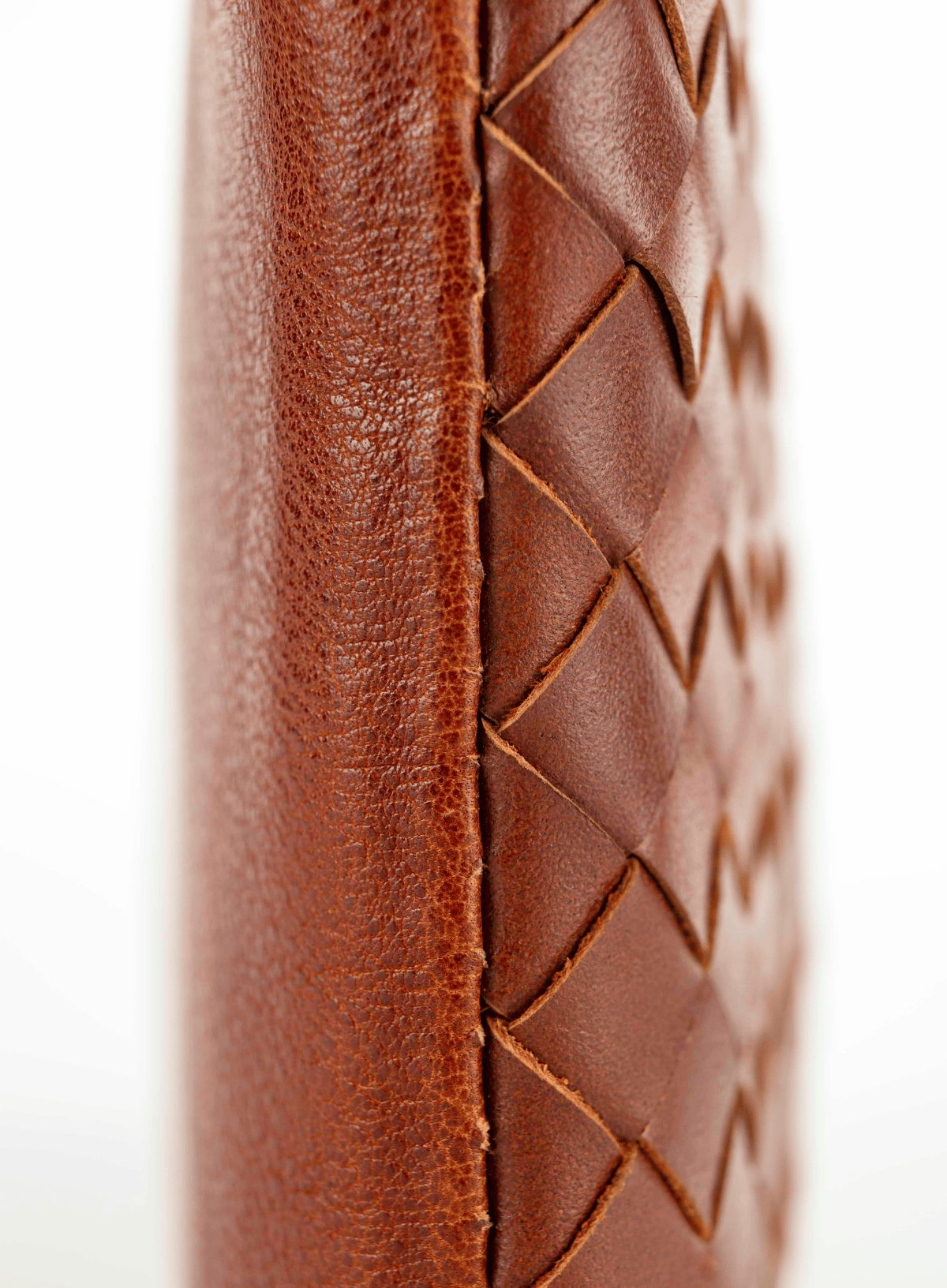 Woven crossbody bag details on a white background