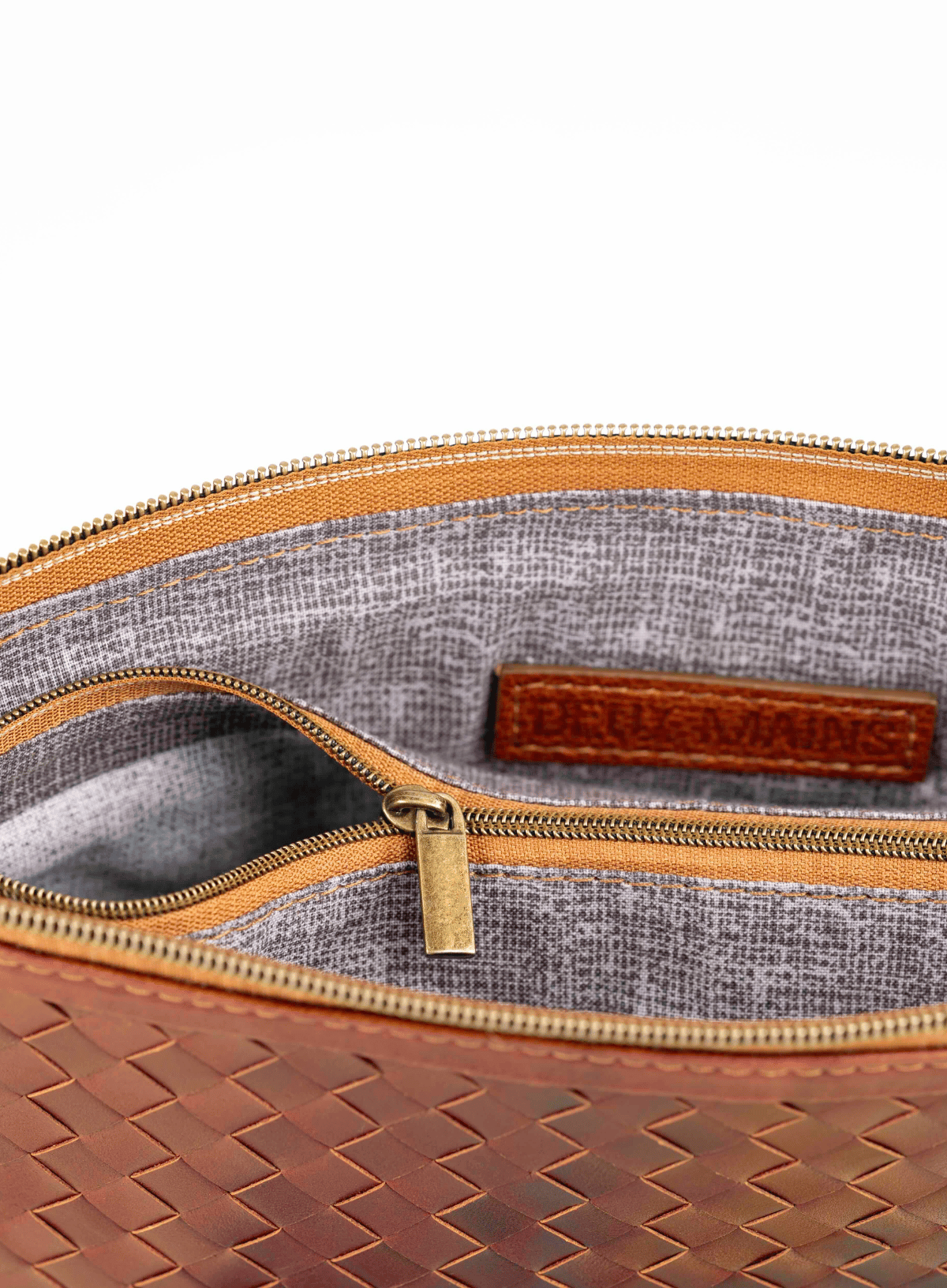 Brown woven handbag interior on a white background