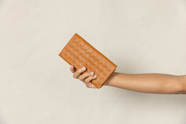 our cognac trifold wallet held up.