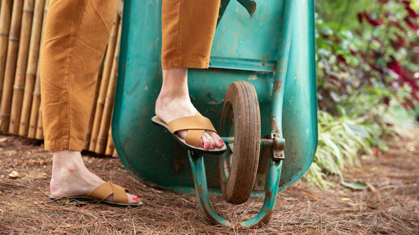 our sandals being worn on woman walking in nature.