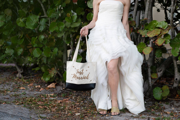 wedding dress worn with bag held.
