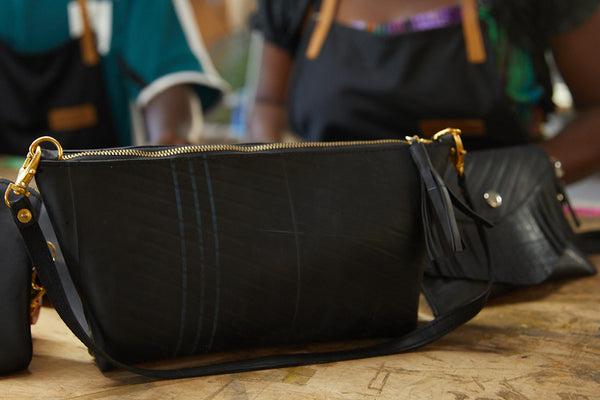 black leather bag on counter.