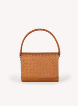 Ideal Crossbody with leather wrapped handle on womens weaved handbag in camel color showcasing front view.