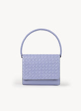 Ideal Crossbody with leather wrapped handle on womens weaved handbag in lilac showcasing front view.