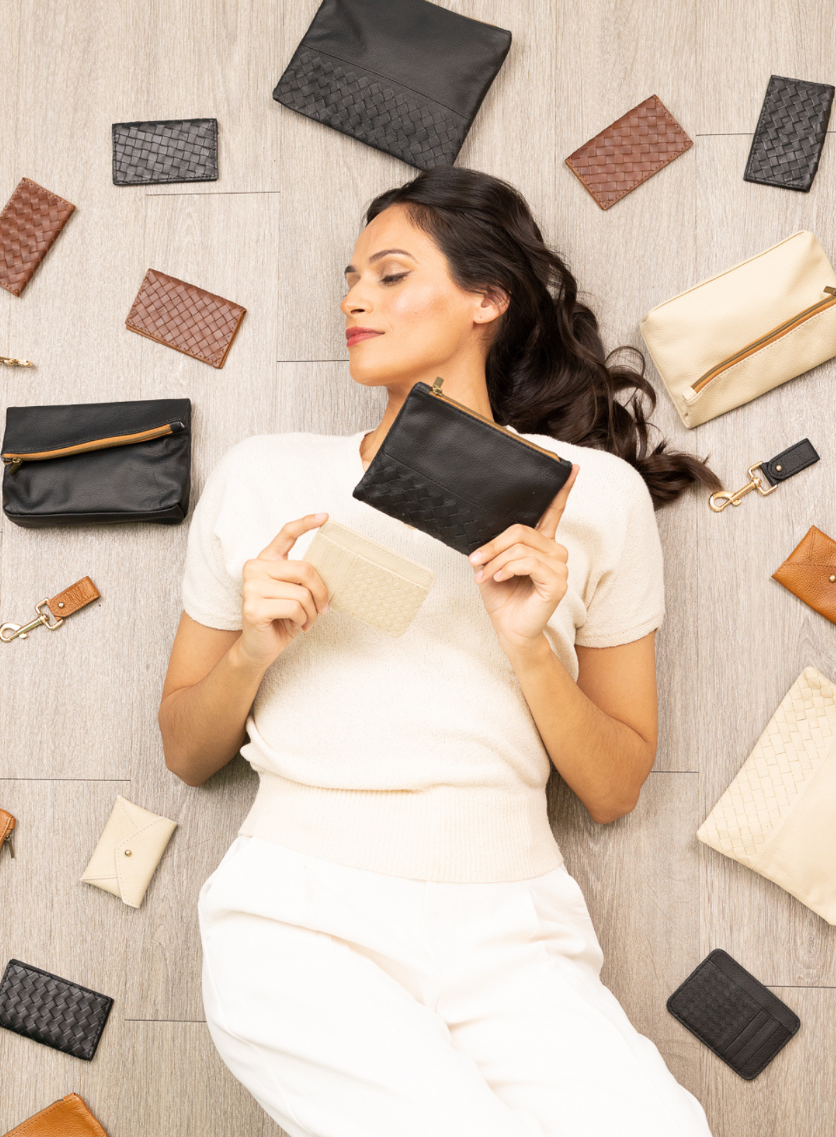 card holder in black from the women's spring collection held by model - front view.