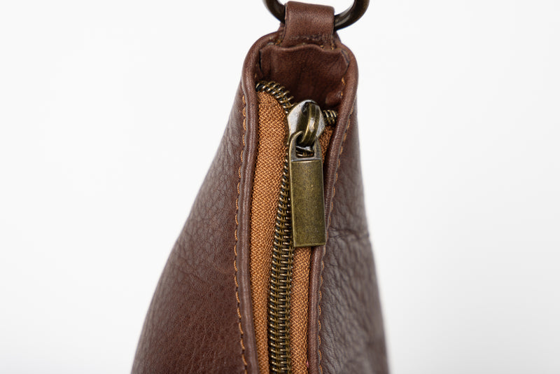 baguette bag from womens bags in brown showcasing exterior view.
