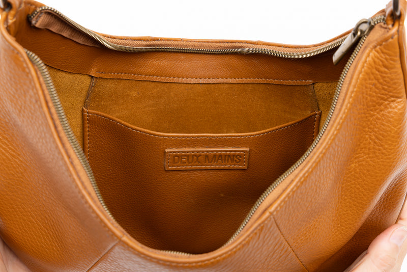 baguette bag from womens bags in honey color showcasing interior view.