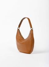 baguette bag from womens bags in honey color showcasing side view.