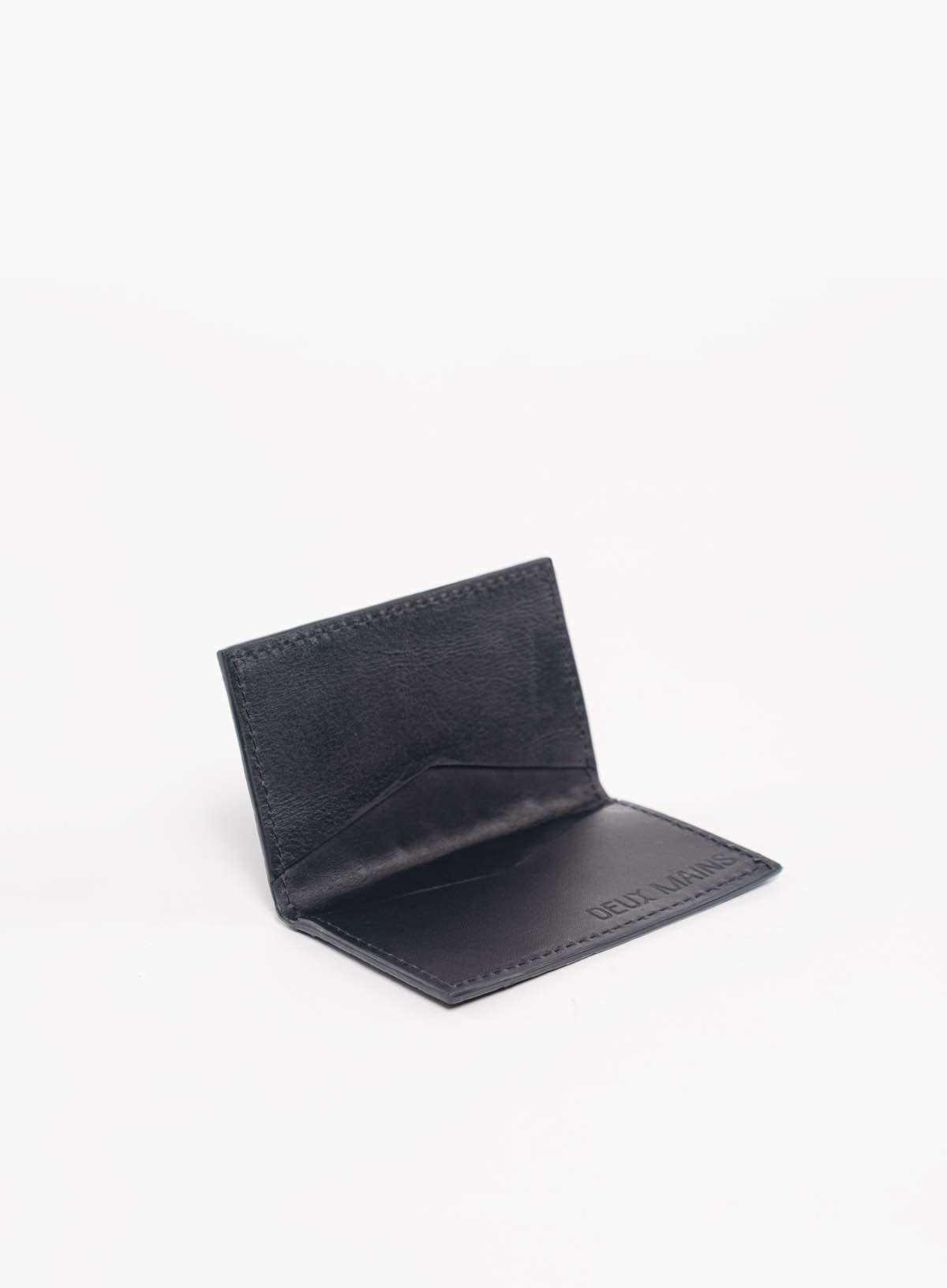 modern woven wallet in black interior view from fall collection.