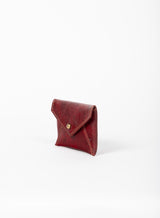 coin pouch from ethically crafted accessories in bordeaux color showcasing side view.