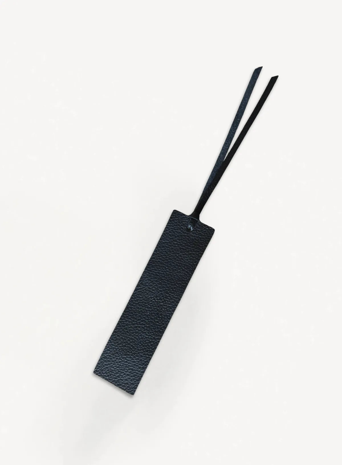 Black bookmark with leather texture, front view.