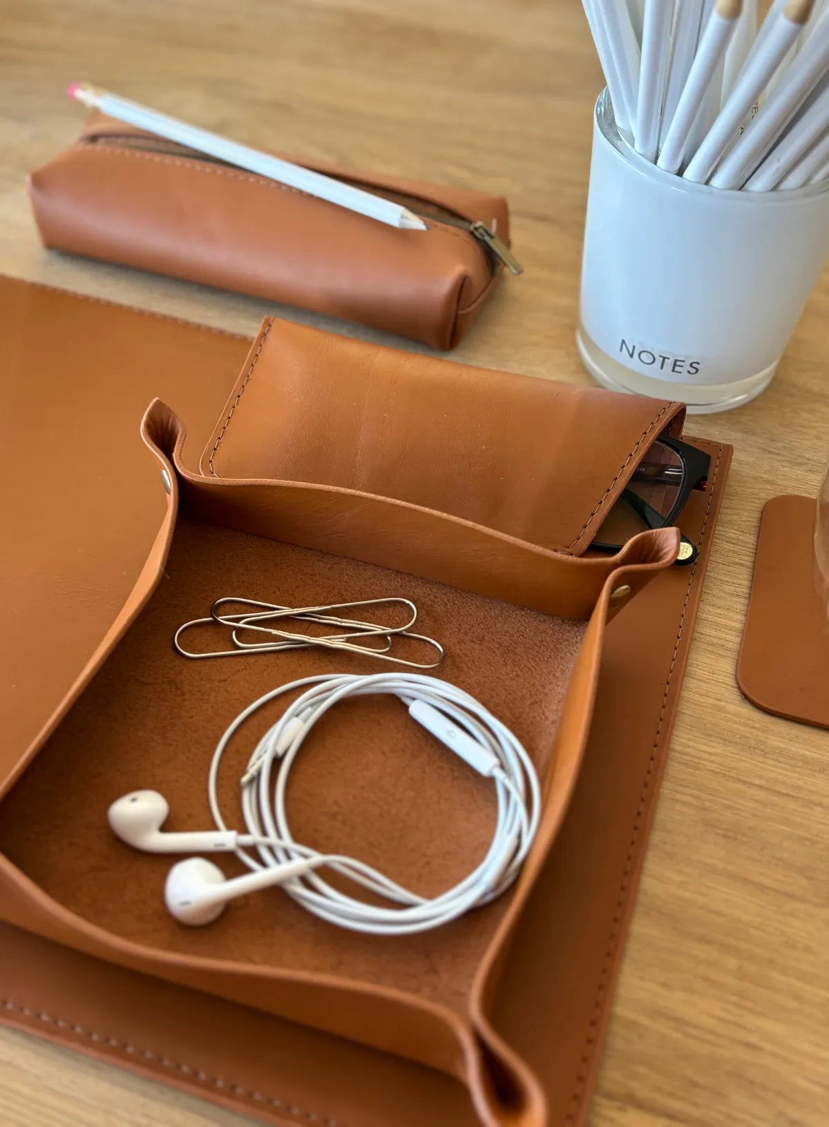 Cognac leather desk organizer with office supplies