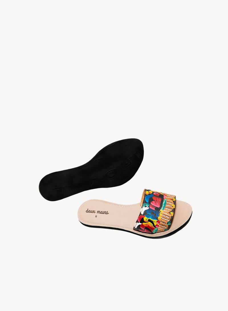 Hand painted slide sandals from the sandal collection revealing the insole.