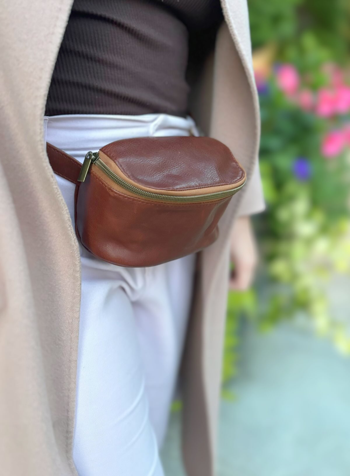 hip bag in mahogany showcasing details of handbag in garden from womens leather spring and summer collection.