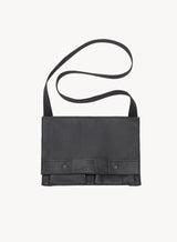immediate action claymore bag in black showcasing the front-view and strap.