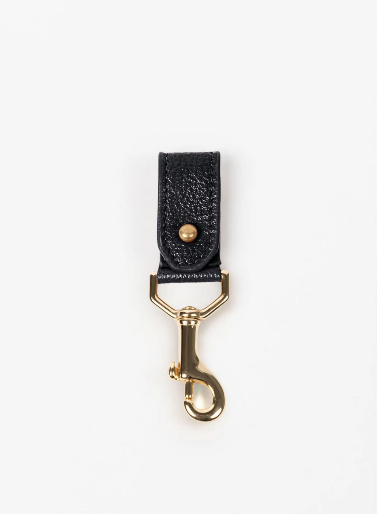 key chain from our ethically crafted accessories in black leather and gold coated metal showcasing front view.