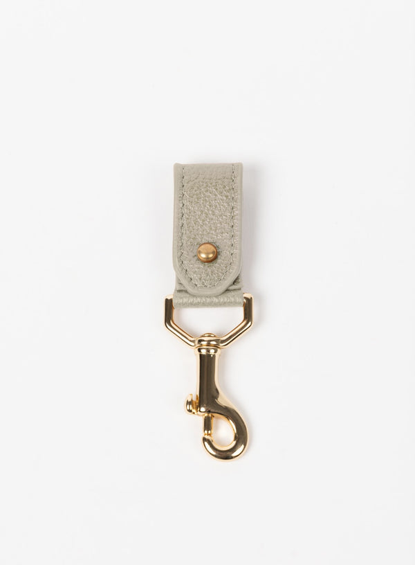 key chain from our ethically crafted accessories in bone leather and gold coated metal showcasing front view.