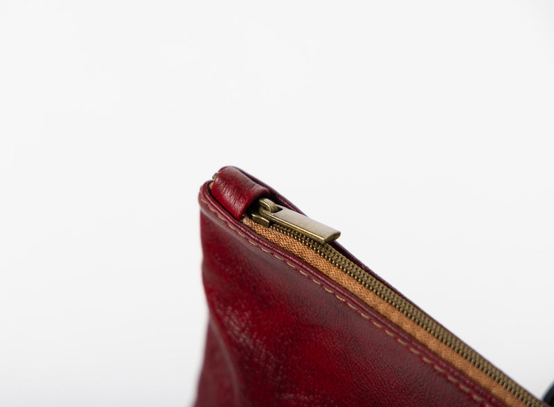    large pouch from ethically crafted accessories in bordeaux showcasing exterior view.