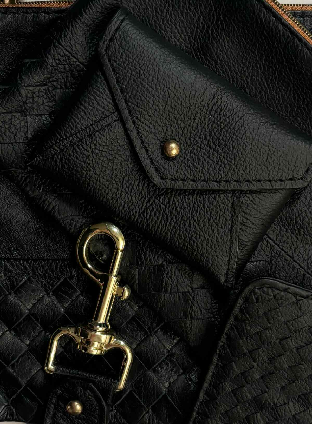 coin pouch from ethically crafted accessories in cognac color held by model showcasing front view.