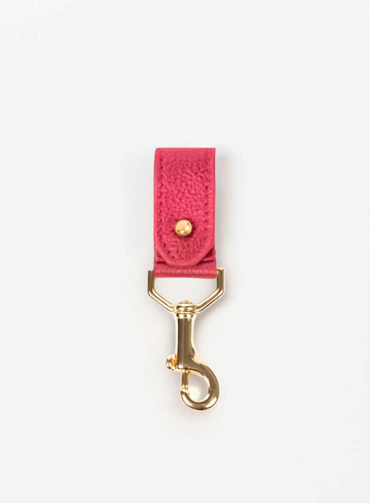 key chain from our ethically crafted accessories in pink leather and gold coated metal showcasing front view.