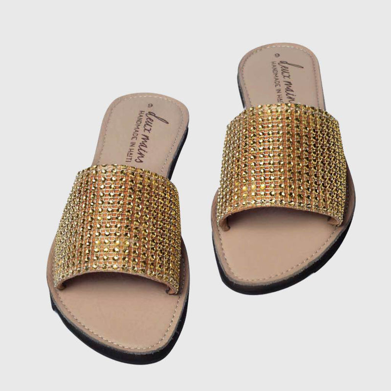 gold rhinestone sandals made in Haiti with tire soles.
