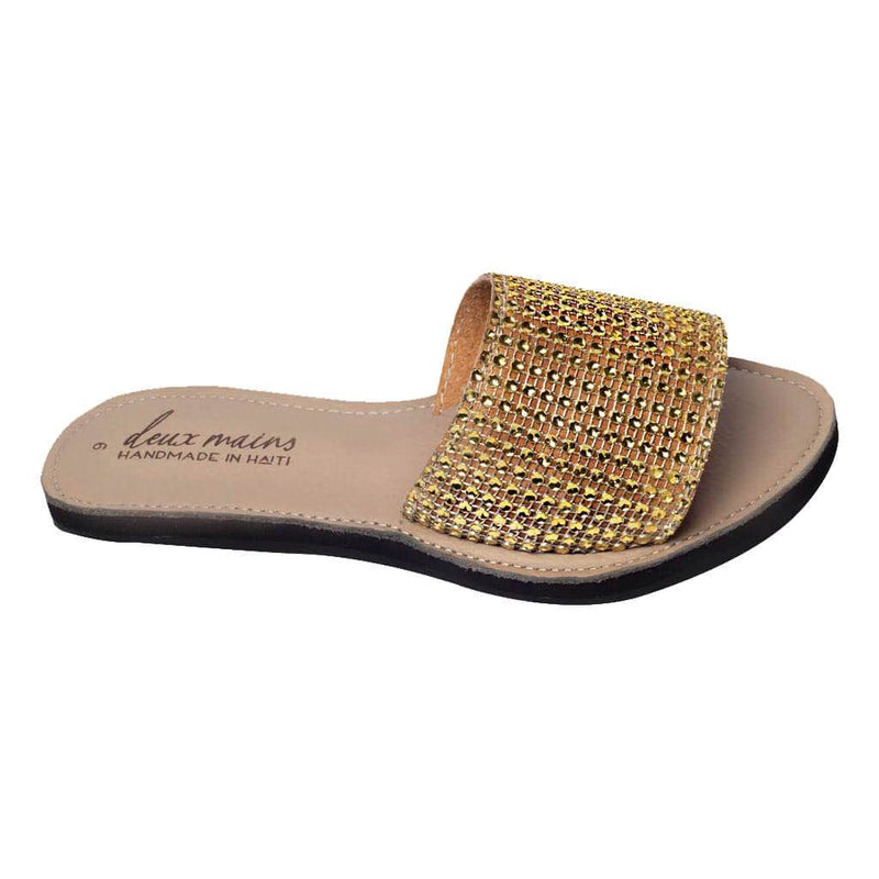one gold rhinestone sandal made in Haiti with tire soles.